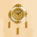 Royal And Gold Plated Hanging Strings Wall Clock In white
